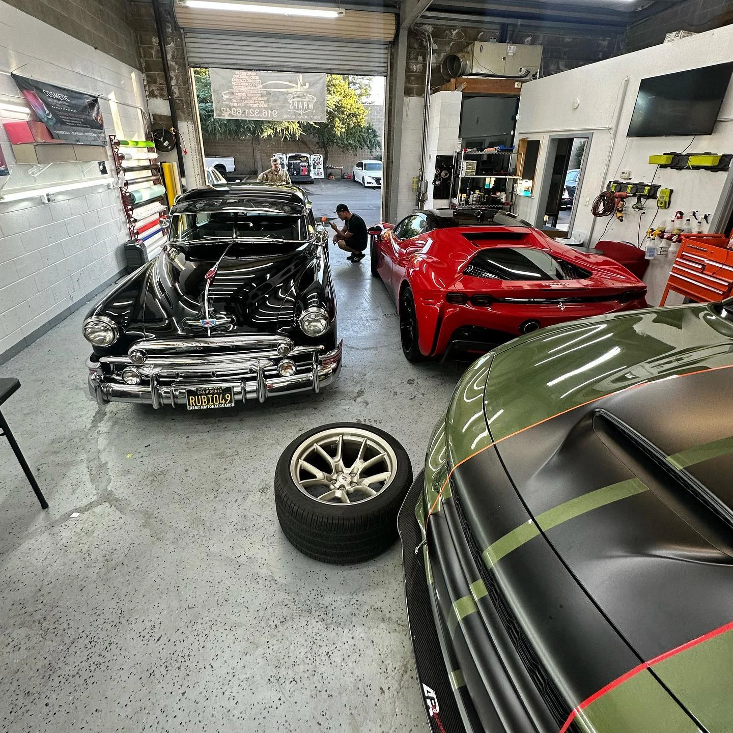 Vehicles inside the Black Sheep Auto Detailing workshop
